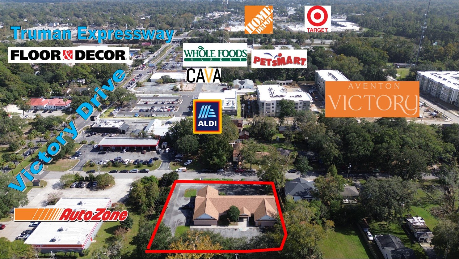 Aerial view showing property and surrounding retail